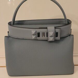 Classy very Unique leather handbag! Light blue. Very cool style.  No brand.